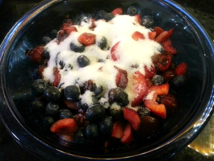 Cut berries with sugar